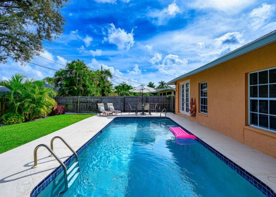 Fenced yard and long inground pool at Naples FL vacation home rental